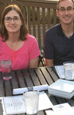 Paul Lynden next to a woman at restaurant table