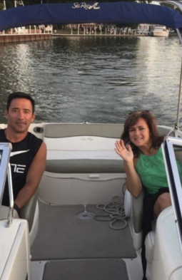 Dr. Chris Tomshack and his wife on a boat
