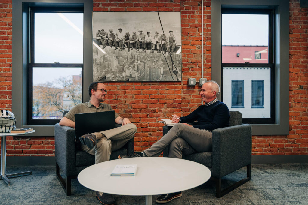 Two men having a discussion in an office