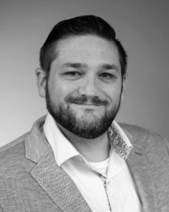 Black and white headshot of Ben Shelly