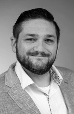 Black and white headshot of Ben Shelly