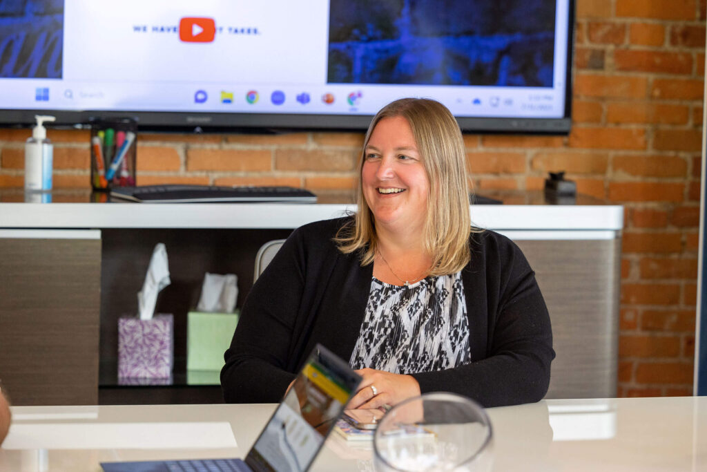 A business woman exploring how franchises work in a conference room.