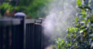 MosquitoNix misting system spraying in a backyard