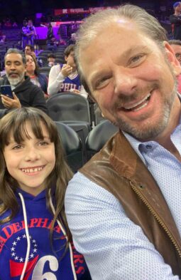 Troy with his daughter at a basketball game
